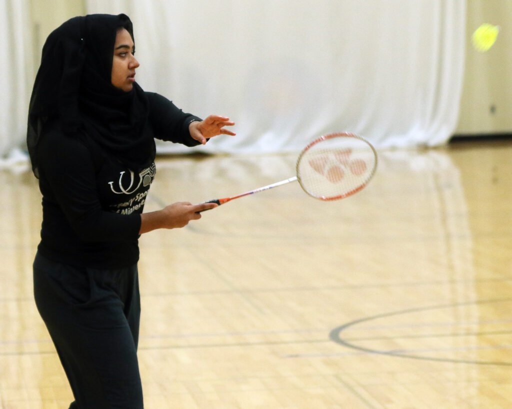 Student playing badminton