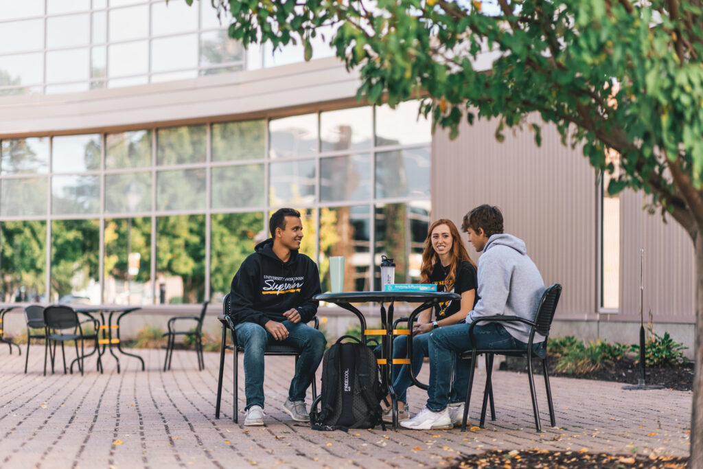 Students sitting outside Yellowjacket Union chatting
