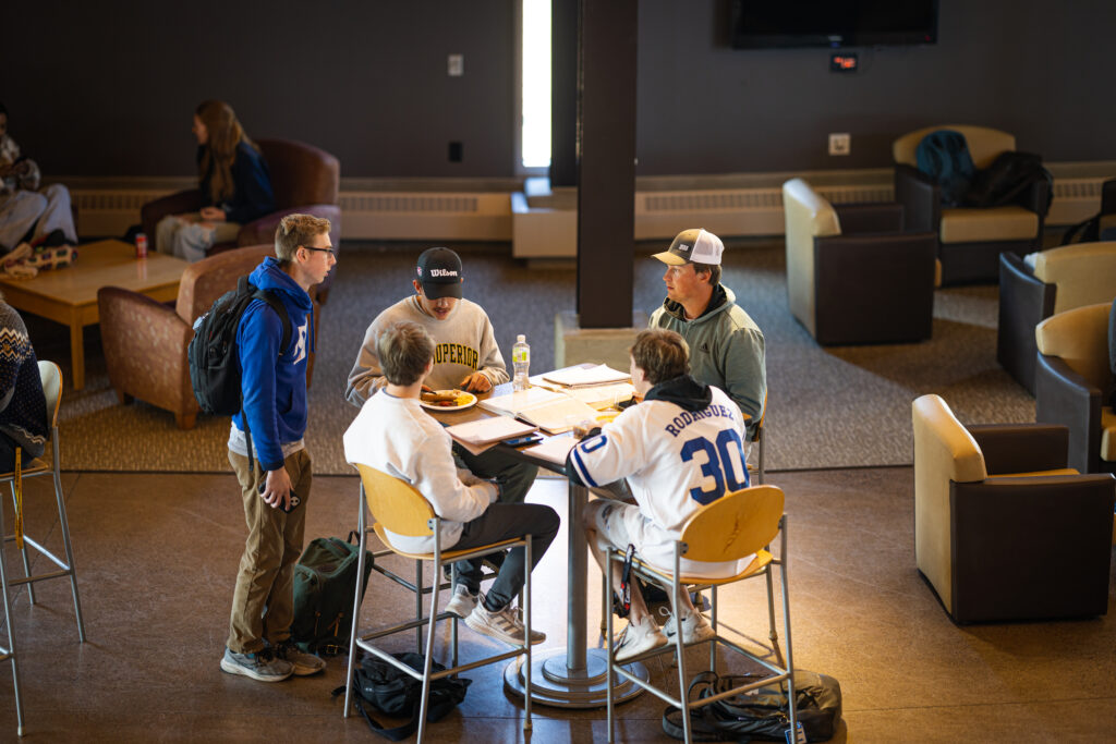 Students sitting at a table in the Yellowjacket Union
