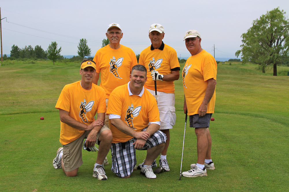 Group photo of a team at the Alumni Golf Tournament