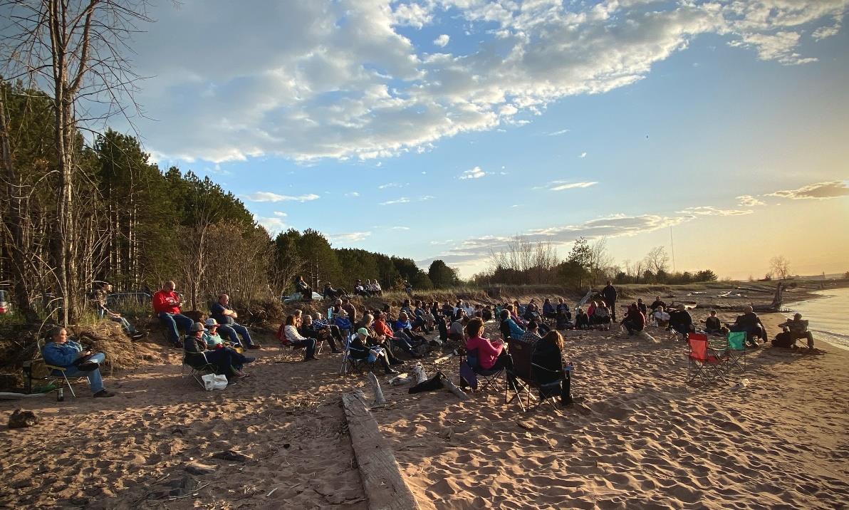 Community members gather on the regained Fond du Lac land at Wisconsin Point in May of 2021 for a talk by Thomas Howes. Image: Deanna Erickson, Lake Superior Reserve