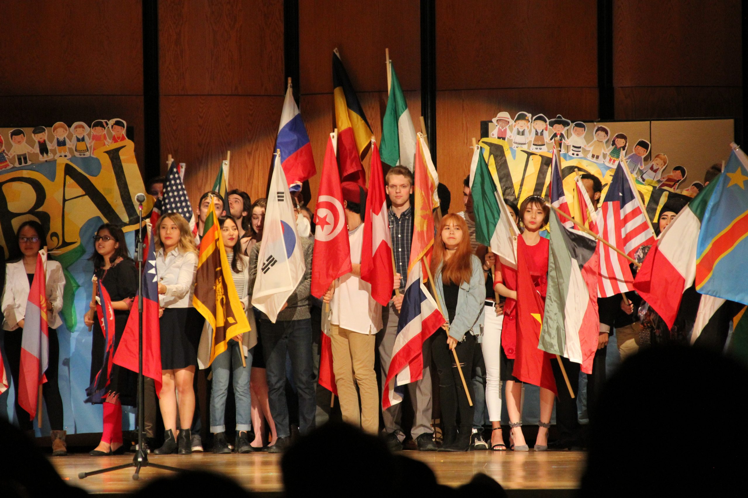 UWS students holding their country's flags in Cultural night.
