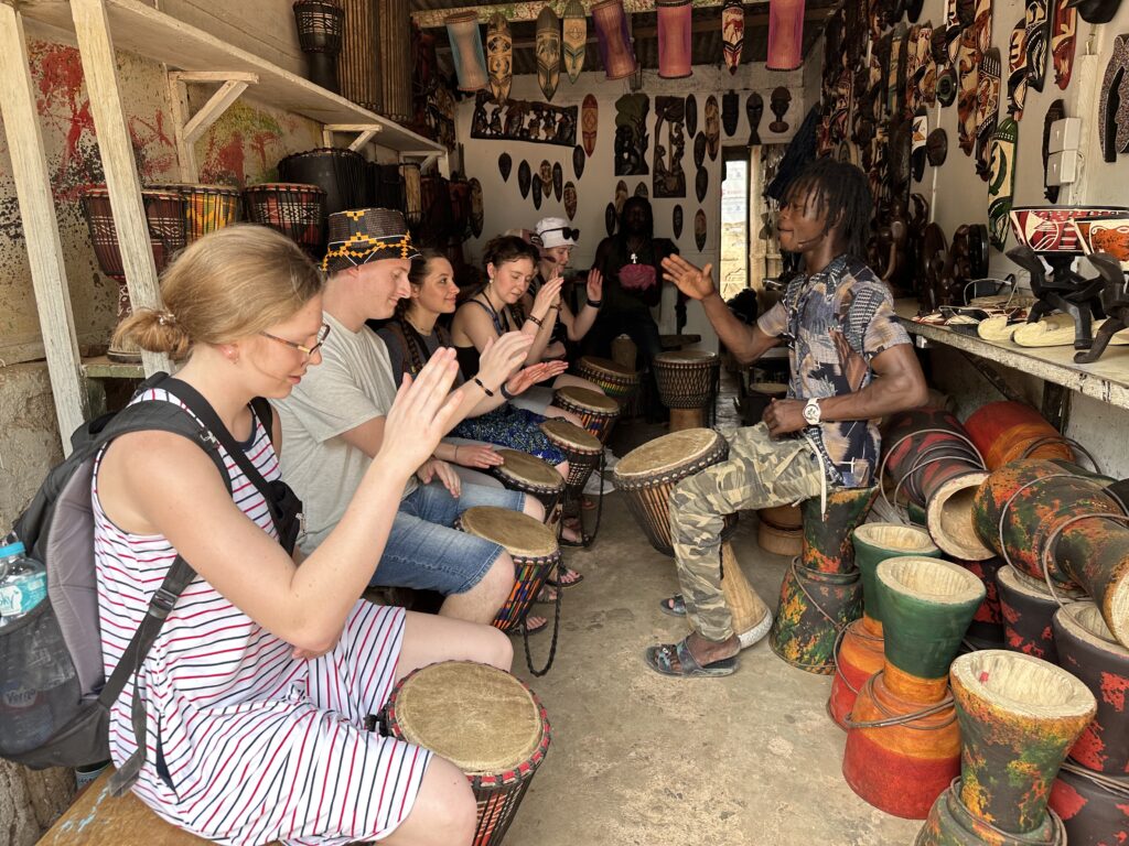 Students learning to play drums