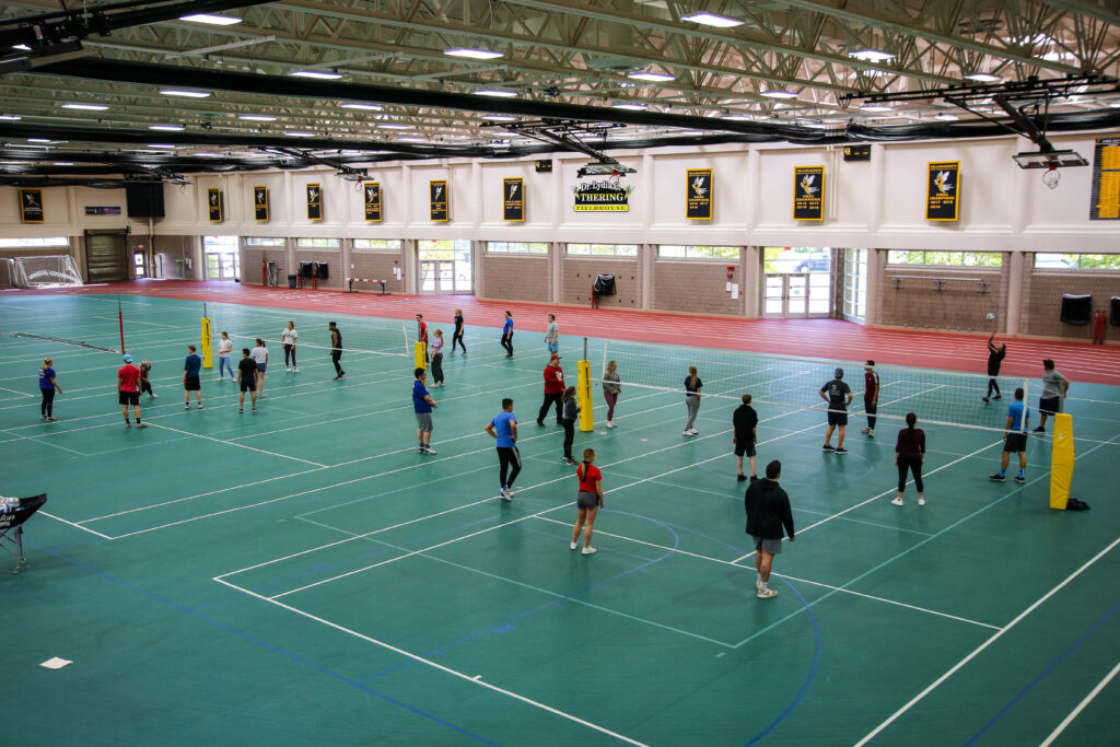 Students playing in a volleyball tournament