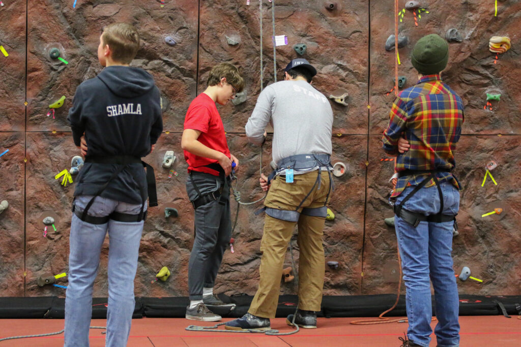 Students at the rock climbing wall