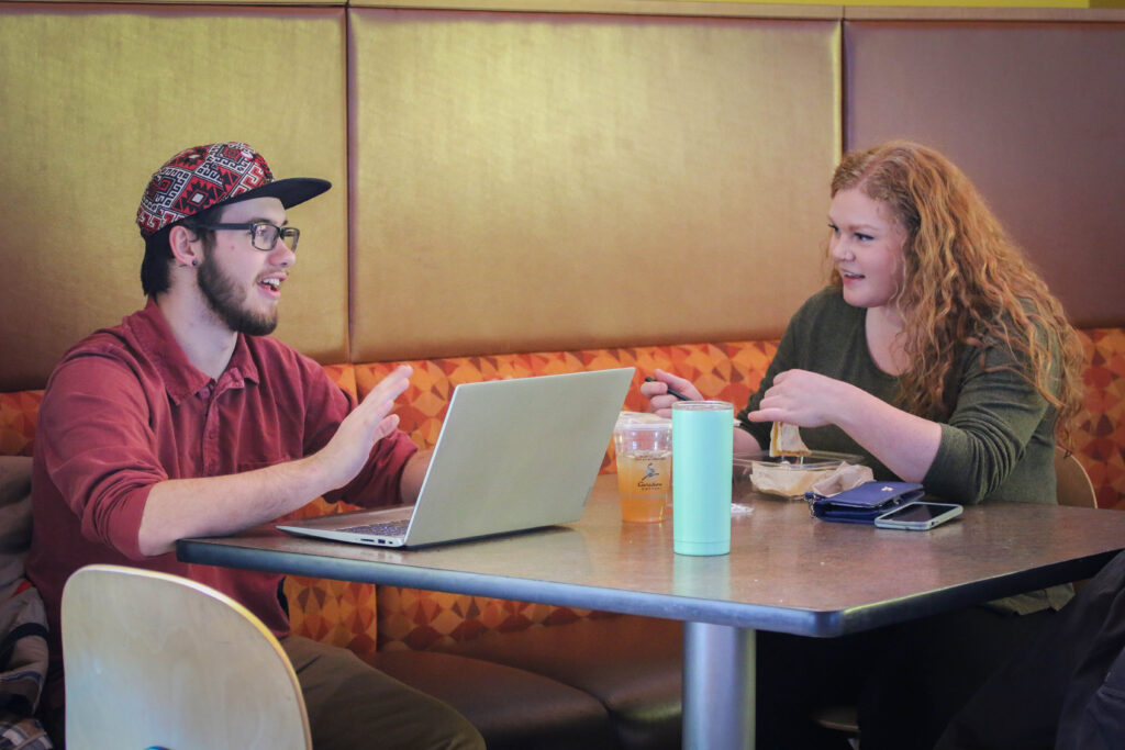 Students talking over lunch in dining hall