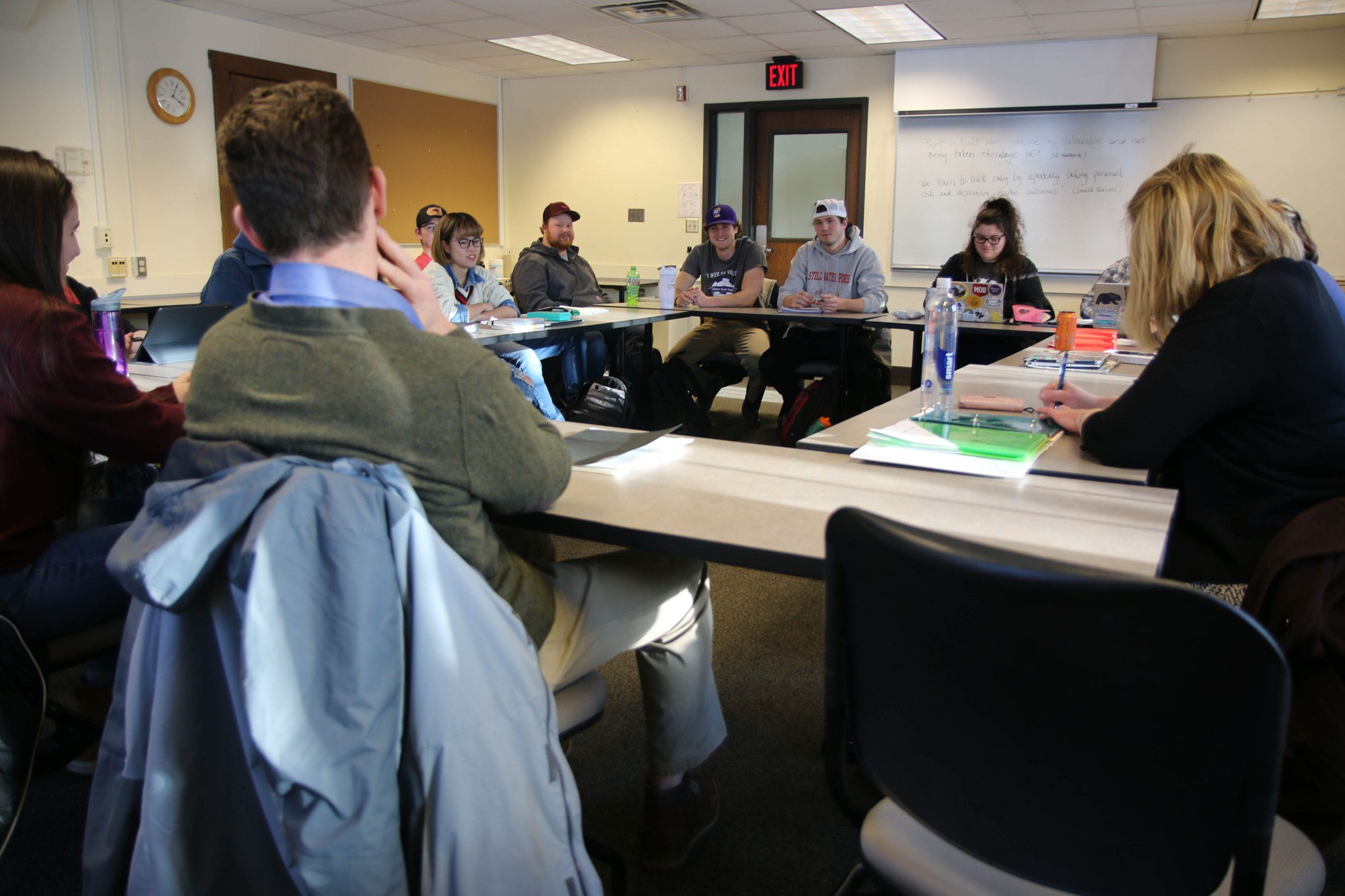 Students sitting in circle in classroom