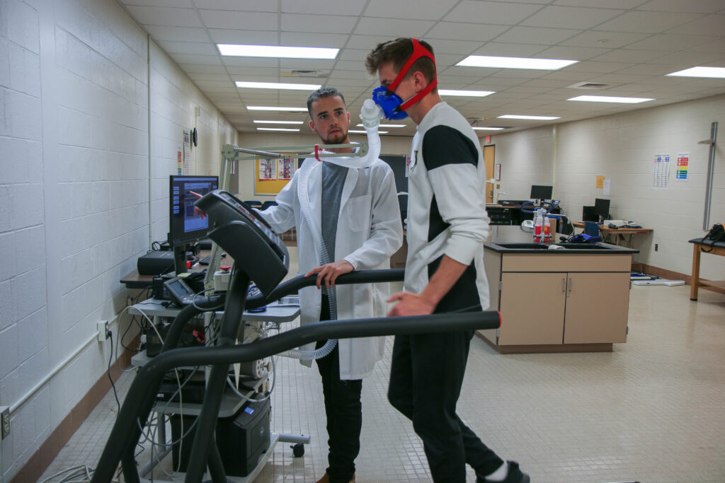 Patient completing physical therapy with doctor