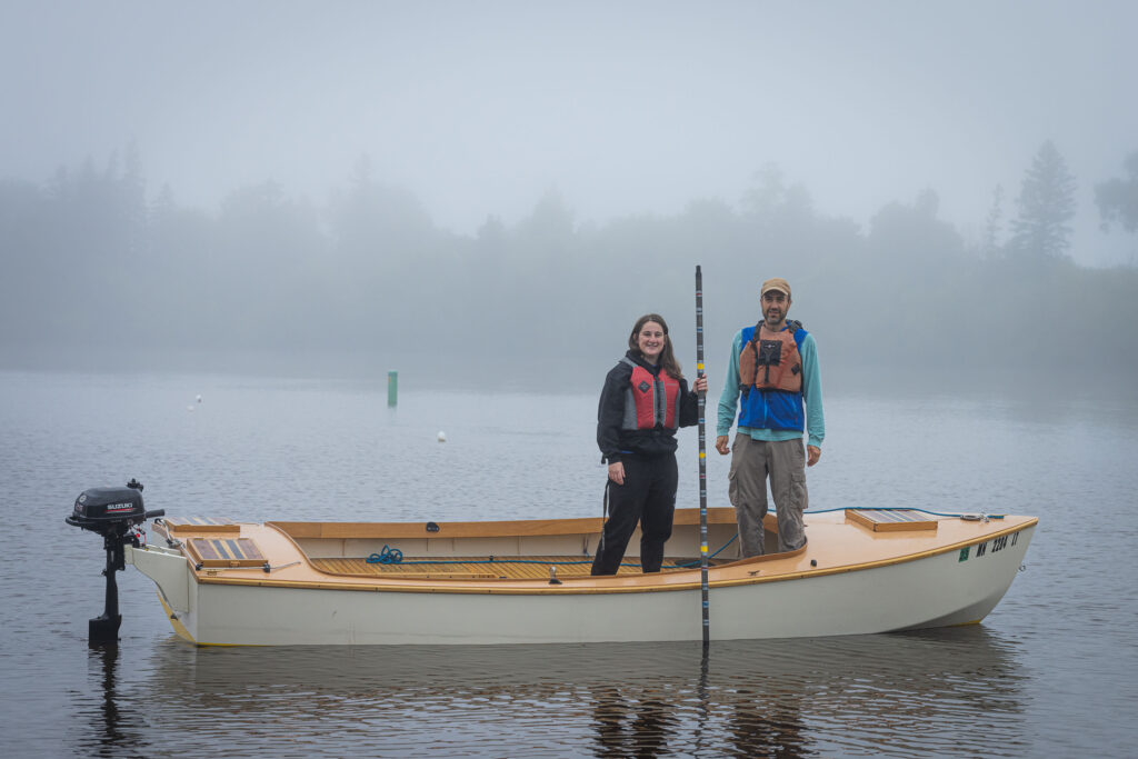 Students standing in boat