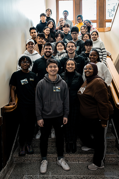 Office of Intercultural Student Success (ISS) team poses with Orientation Welcome Leaders and new Spring 2024 international students in Old Main.