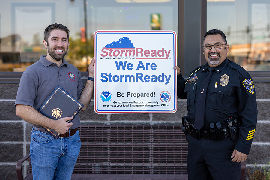 Joe Moore, Morning Coordination Meteorologist for the National Weather Service, left, presents Joe Eickman, Chief of Police for UW-Superior’s University Police Department, with a StormReady designation. UW-Superior is the only college in the region to receive this designation.
