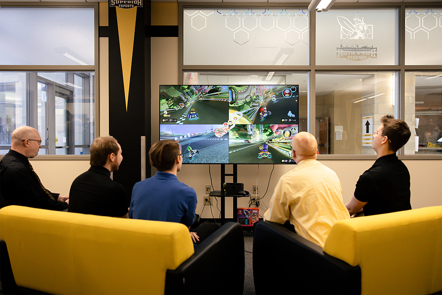 The University of Wisconsin-Superior the celebrated the addition of esports to its list of extracurricular activities on Thursday, March 28, with a showcase event in its new esports gaming room. The event was highlighted by student team members competing against UW-Superior’s Dean of Students, Harry Anderson, and Vice Chancellor of Administration & Finance, Jeff Kahler, in a friendly game of Mario Kart.