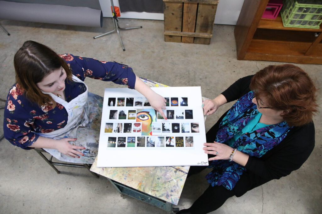 Two students creating collage