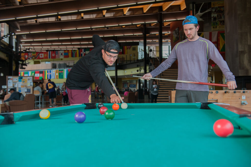 Students playing pool in the Yellowjacket Union