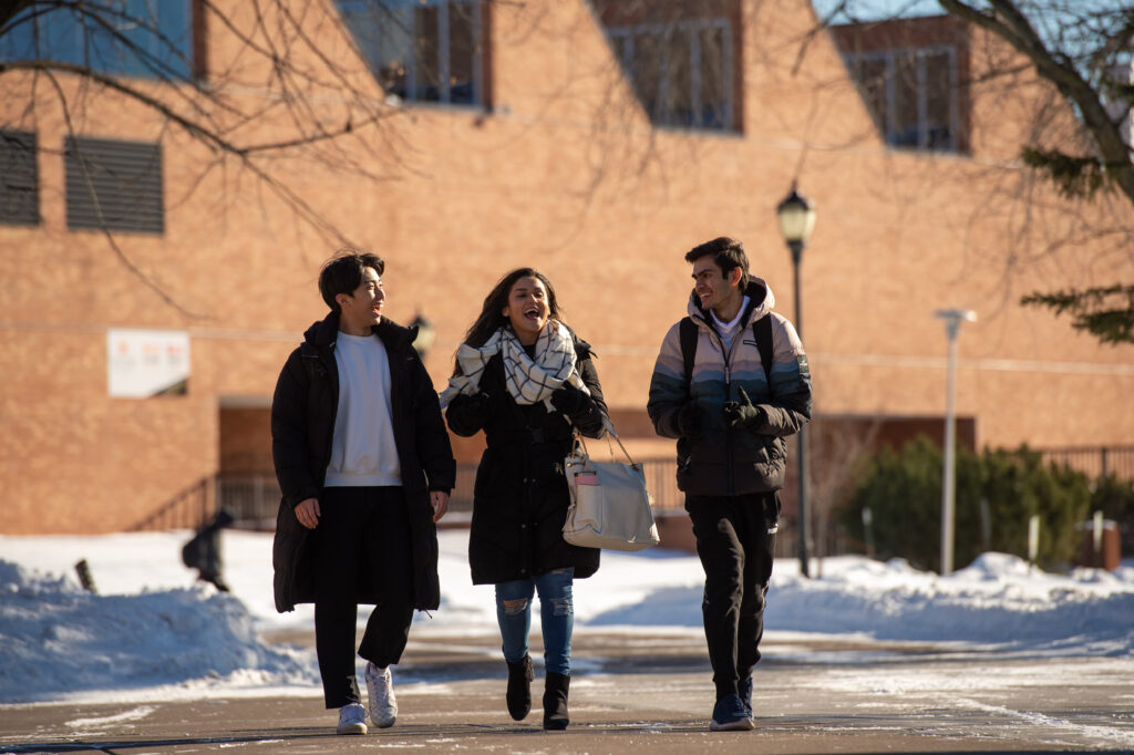 Students walking through snowy campus