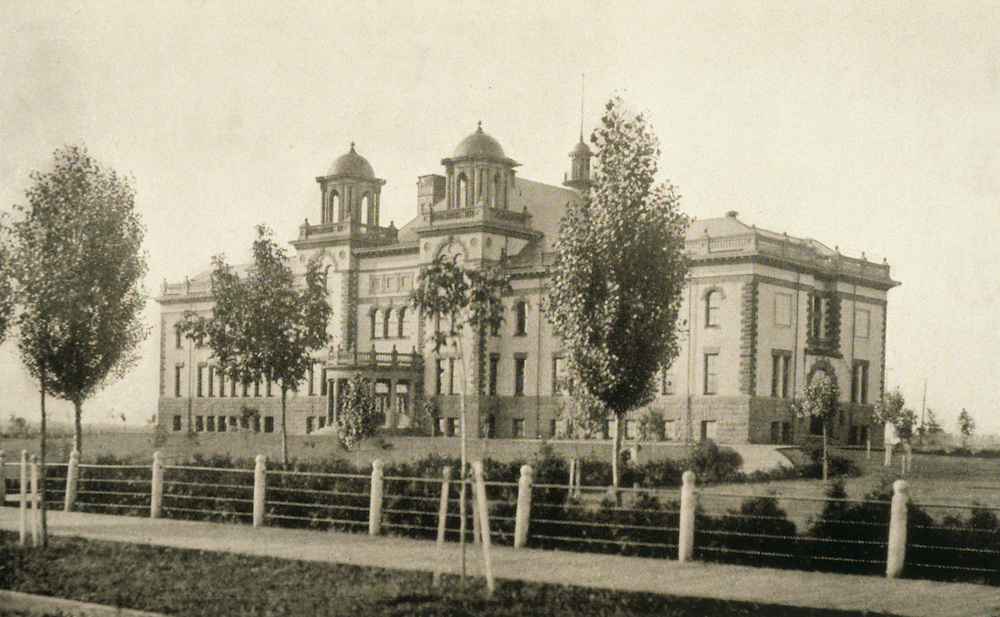Old photograph from the 1900's of an old campus building.