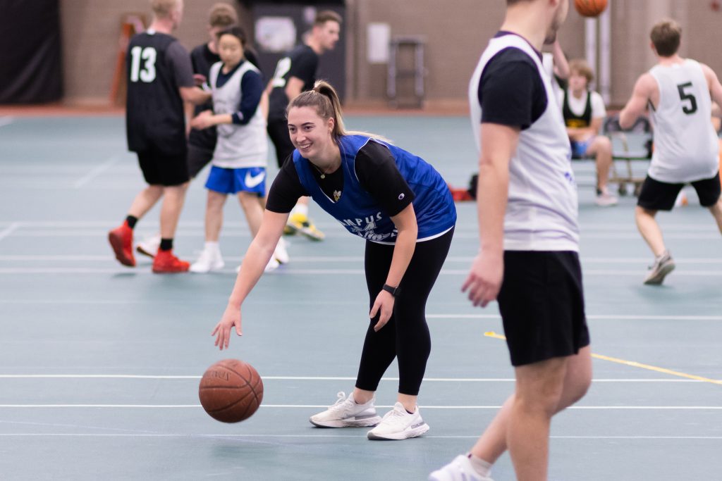 UW-Superior student playing intramural basketball