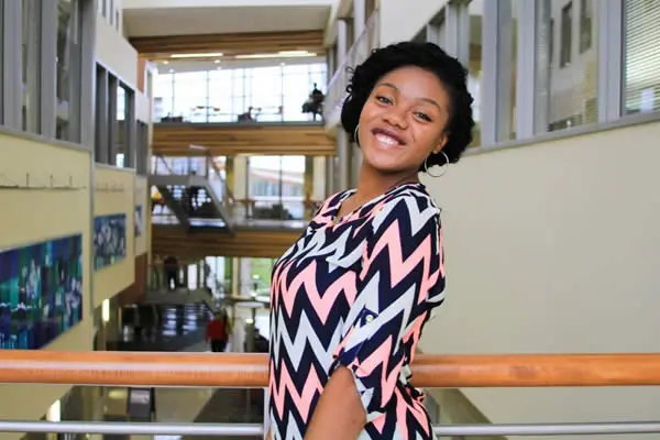 Smiling student in school building