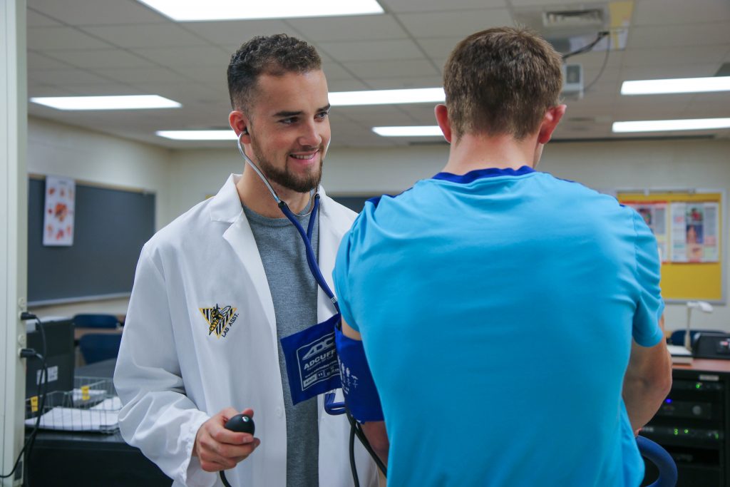 UW-Superior student practicing taking blood pressure