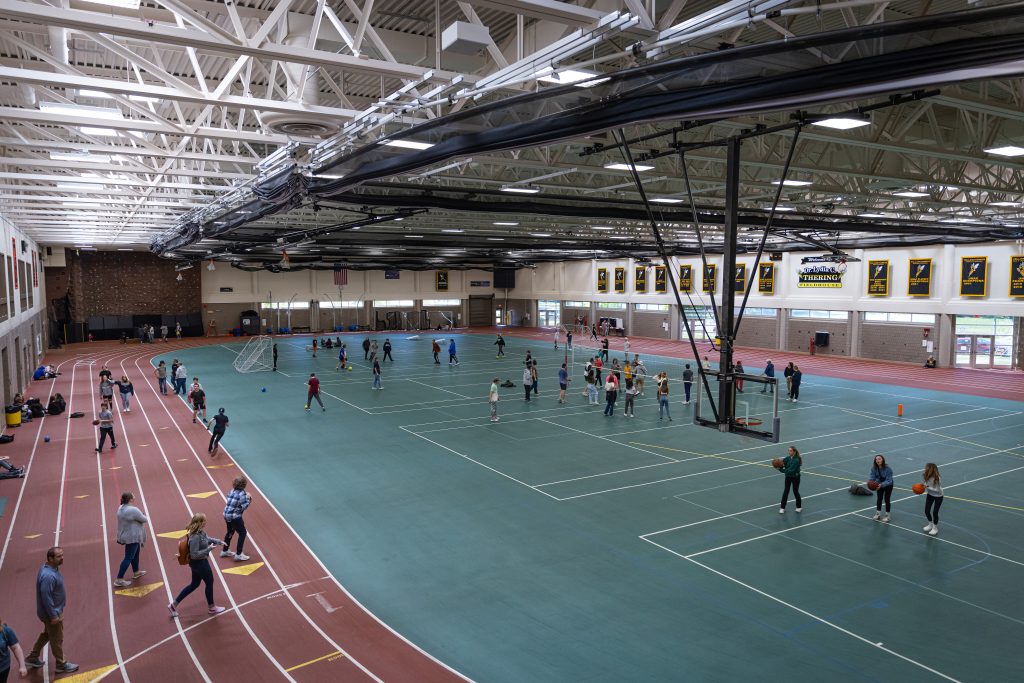 Students being active in the fieldhouse