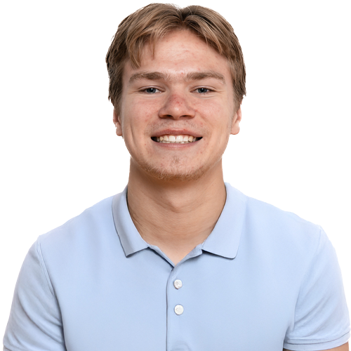 A young man with short, light brown hair smiles at the camera. He is wearing a light blue polo shirt and exudes confidence, embodying the spirit of superior outcomes against a plain, light background.