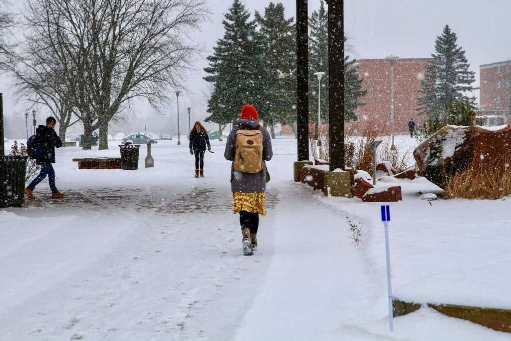 Students walking on campus in the winter
